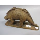 Carved wooden figure of a Stegosaurus