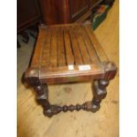 Oak stool with a slatted seat on turned supports with stretchers made from timber removed from H.M.