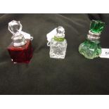 Green / clear glass perfume bottle with matching green stopper and white metal mount,