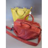 Modern yellow handbag and a modern red handbag