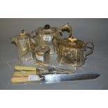 Silver plated three piece teaset, silver topped dressing table bottle,