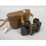 Pair of Negretti and Zambra binoculars together with a shooting stick