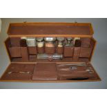 Gentleman's leather cased travelling dressing set with silver mounted glass bottles (some losses),