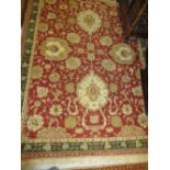 Group of three various Indo Persian rugs with stylised floral design on a beige and red ground with