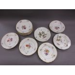 Group of nine Copenhagen porcelain plates painted with floral sprigs within moulded basket weave
