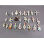 Box containing a collection of twenty five various porcelain half dolls