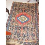 Early 20th Century Kurdish rug with an all-over Boteh design on a blue ground with borders