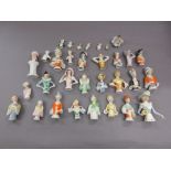 Box containing a collection of thirty two various miniature porcelain half dolls