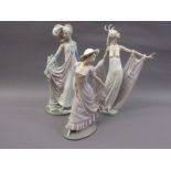 Two Lladro figures of ladies wearing evening dress together with another similar