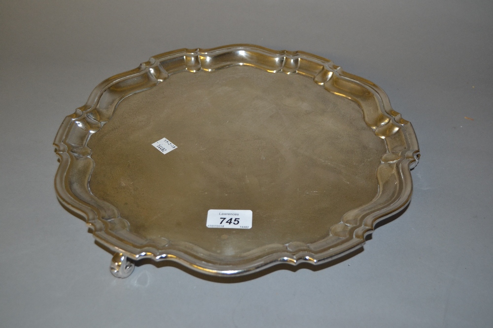 20th Century Chester silver salver in 18th Century style with a shaped moulded rim on three scroll