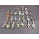Box containing a collection of twenty five various miniature porcelain half dolls