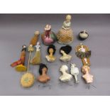 Collection of various half dolls mounted to pincushions,