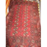 Modern Tekke rug having two rows of nine gols with multiple borders on a burgundy ground,