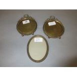 Pair of late 19th or early 20th Century miniature gilt brass circular photo frames with wreath and
