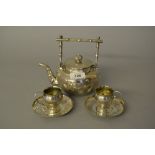 Chinese silver teapot with engraved decoration together with two similar Hong Kong marked silver