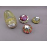 Two Millefiori glass paperweights together with two two other paperweights