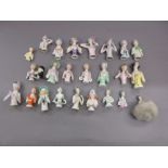 Box containing a collection of twenty five various miniature porcelain half dolls