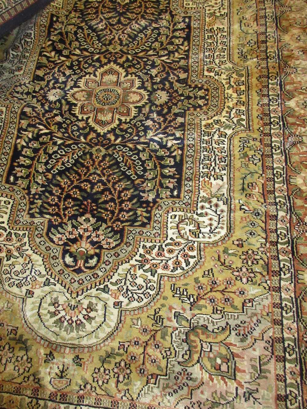 Indo Persian cotton rug with silk finish with a central floral medallion and all-over design with