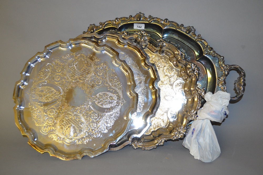 Two modern oval plated two handled trays (one at fault),