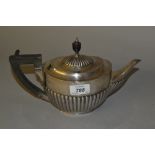 Silver teapot of oval half fluted design