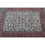 Isfahan carpet with all-over palmette design on an ivory ground with borders,
