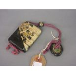 Japanese crackle glazed four section pottery inro with netsuke and ojime on a purple cord