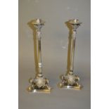 Pair of good quality silver plated cast candlesticks with reeded tapering columns and three paw