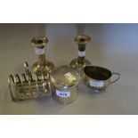 Silver cylindrical dressing table bottle, silver toast rack,