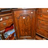 Small 18th Century oak hanging corner cabinet with a single moulded panelled door