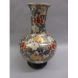 Modern oriental gilded and floral decorated baluster form vase on wooden stand