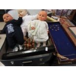 Blue case containing modern dolls, shove ha'penny board,