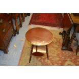 Early 20th Century circular mahogany and brass mounted two tier occasional table on bobbin supports