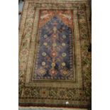 Indo Persian cotton prayer rug with tree of life design on a blue ground with borders,