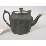 19th Century black basalt teapot, relief moulded with cherubs,