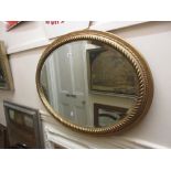 Gilt framed oval rope twist design wall mirror with bevelled plate CONDITION REPORT