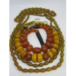 Quantity of amber coloured bead necklaces