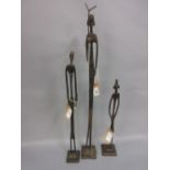 Three cast copper graduated figures