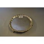 Late Victorian circular silver salver on three hoof supports, London,
