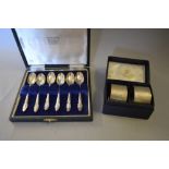 Cased set of six silver coffee spoons together with a cased pair of silver napkin rings