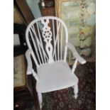 White painted wheel back open arm kitchen chair on turned supports with stretchers