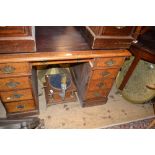 19th Century oak pedestal desk having an arrangement of nine drawers with brass swan neck handles