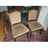 Pair of mahogany carved side chairs having brown suede upholstery on square tapering and spade