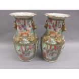 Pair of 19th Century Chinese Canton famille rose baluster form vases with dog of foe side handles