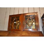 Small Edwardian wall cabinet with two bevelled and bar glazed doors