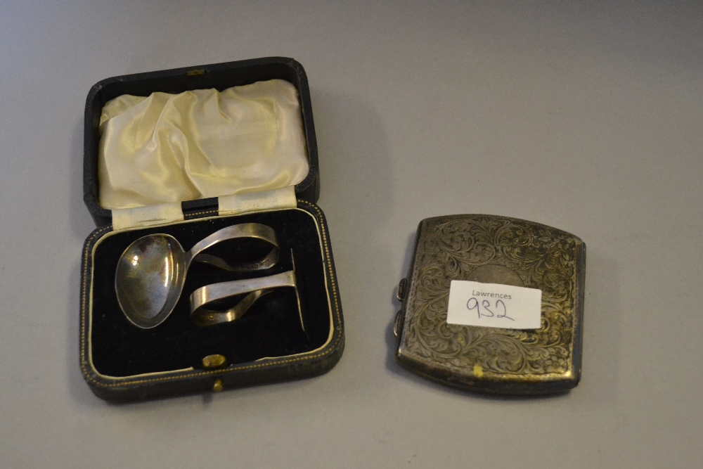 Cased silver spoon and pusher and a silver cigarette case