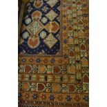 Turkoman Belouch carpet of geometric floral design on a wine ground with multiple borders,
