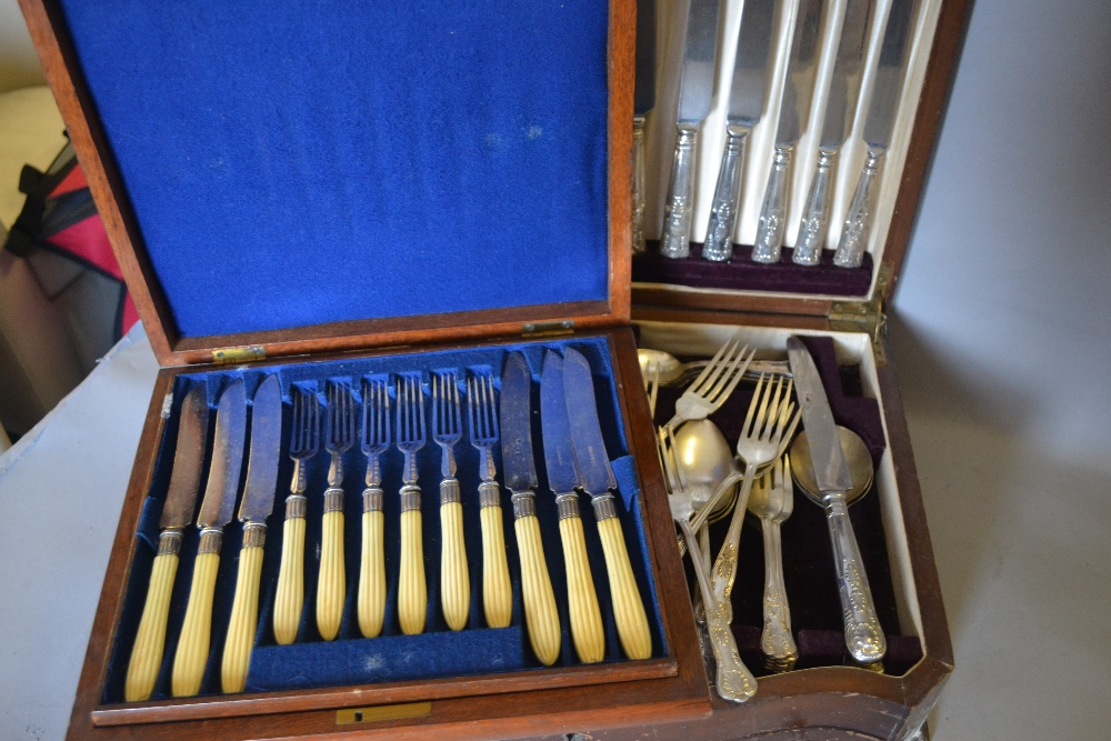 Walnut cased set of silver plated dessert knives and forks,