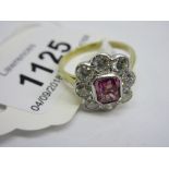 Diamond and pink sapphire dress ring, the central sapphire of approximately 1.