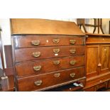 George III mahogany bureau with a fall front enclosing a fitted interior over four graduated