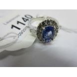 18ct White gold sapphire and diamond cluster ring, the sapphire approximately 1.